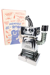 Angled Hemper Hi-Robot XL chrome recycler bong posed in front of retro comic-style box, showing raised robot arm and matching bowl.