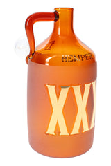 Amber moonshine bottle glass bong with frosted XXX lettering and side handle, close studio view highlighting the thick glass body.