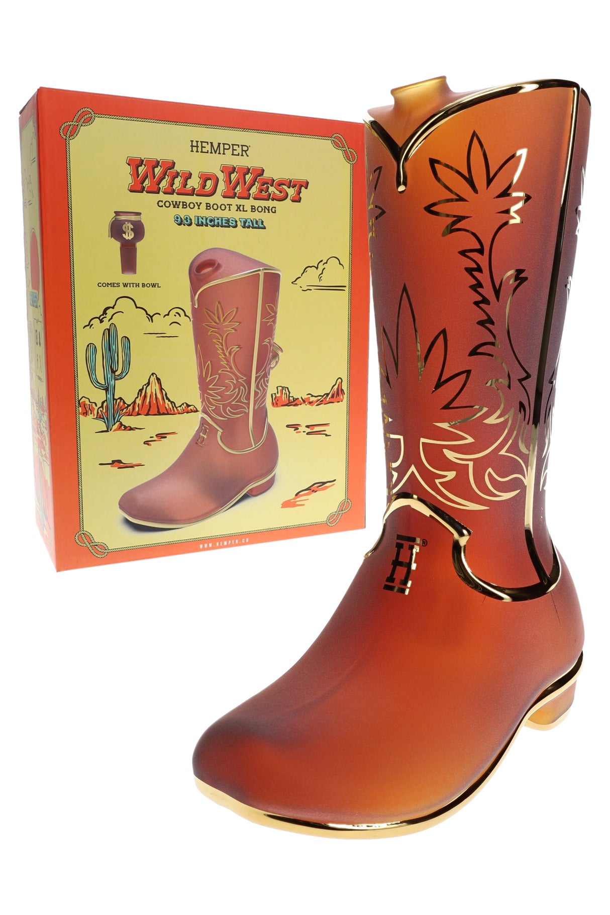 Hemper Wild West Cowboy Boot XL glass bong posed beside its yellow desert-themed retail box, highlighting frosted amber body and gold accents.