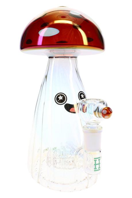Front view of Hemper 9.5″ Trippy Shroom XL glass bong with red iridescent mushroom cap and smiling face on clear scalloped body.