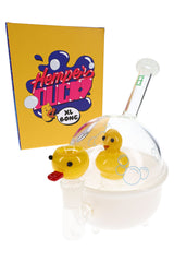 Hemper Ducky XL 8-inch glass bong shaped like a white bathtub with clear dome and yellow duck perc beside bright yellow box.