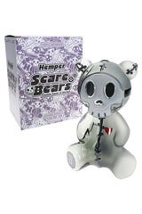 Hemper Scare Bears Teddy Bear XL bong posed beside purple Scare Bears box, creepy-cute character water pipe ready for collectible display.