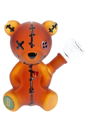5.5-inch Hemper Scare Bears amber teddy bear glass bong with stitched details, button eye and clear bowl, front angle on white background.
