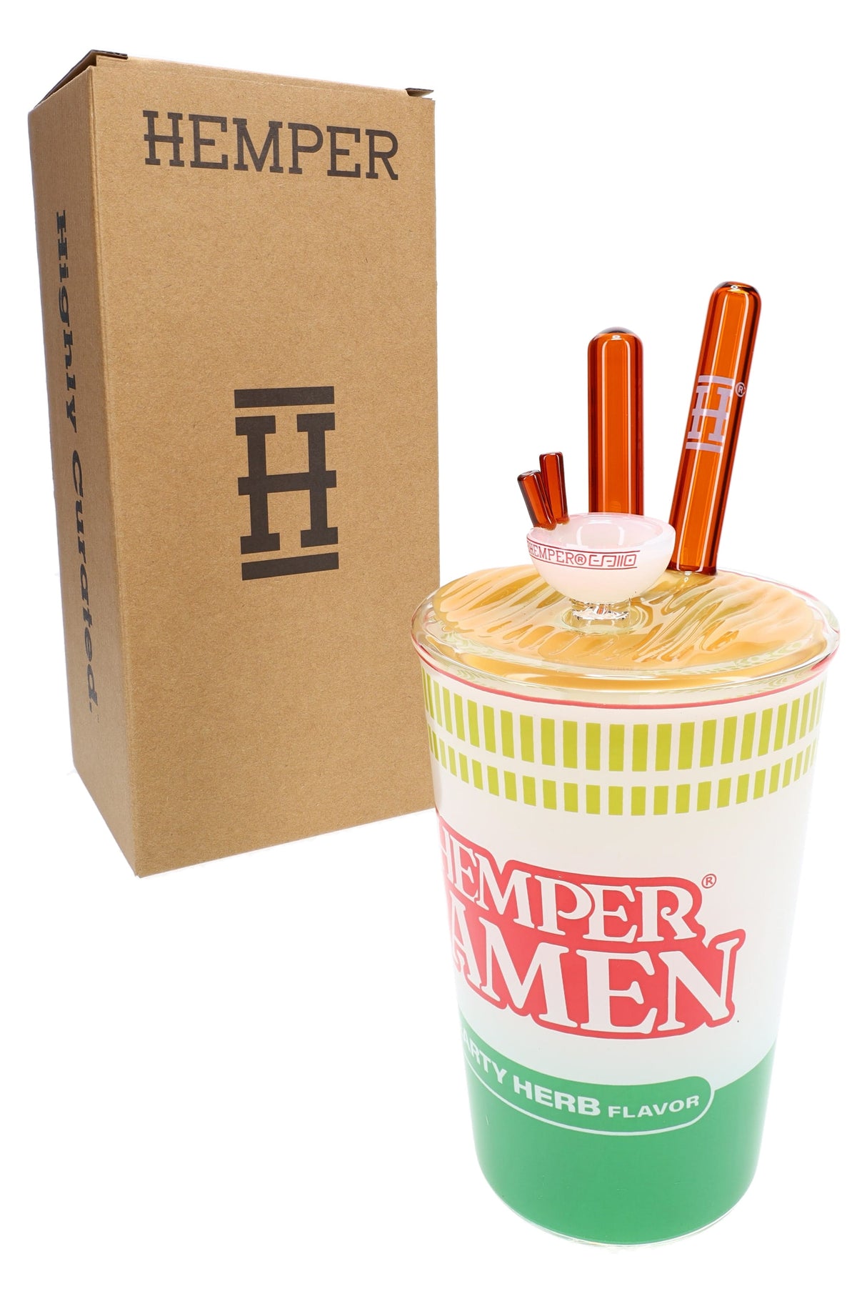 Hemper ramen cup XL bong beside plain brown Hemper box, showing orange glass chopsticks and noodle lid detail