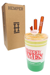 Hemper ramen cup XL bong beside plain brown Hemper box, showing orange glass chopsticks and noodle lid detail