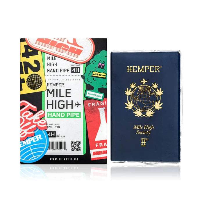 HEMPER Mile High Passport Glass Hand Pipe with navy and gold artwork beside its travel-themed retail box