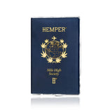 Front of the HEMPER Mile High Passport Hand Pipe showing gold globe artwork and lettering on navy