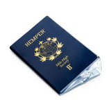 Angled front view of the HEMPER Passport Glass Hand Pipe showing gold artwork and clear glass edges