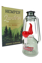Hemper Lantern XL glass bong in smoke grey with red flame perc posed beside forest graphic gift box for retail presentation.