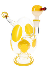 Clear polka-dot glass bong with yellow accents and yellow base ring, matching yellow bowl slide installed