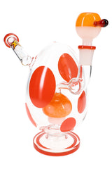 Clear glass bong with red polka dots and red base ring, matching red-topped bowl slide, front view