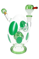 Clear polka-dot glass bong with green accents and green base ring, matching green bowl slide, straight-on view