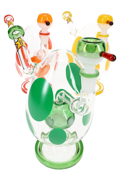 Three polka-dot glass bongs grouped together—green, red, and yellow accents—with matching colored bowl slides and base rings on a white background
