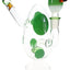 Compact green-spotted egg glass bong with showerhead perc and matching bowl on round pedestal base.
