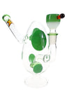 Compact green-spotted egg glass bong with showerhead perc and matching bowl on round pedestal base.