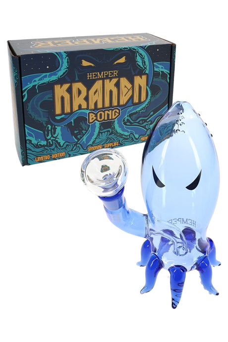 Mini Hemper Kraken blue glass bong posed beside its Kraken Bong box, showing tentacle bowl arm and compact tabletop size.