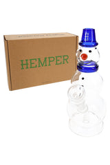 Hemper snowman glass bong posed in front of brown Hemper box, showing gift-ready holiday packaging.