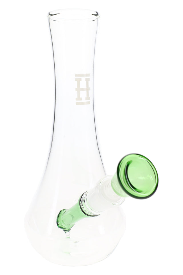 Clear Hemper 7-inch vase glass bong with green angled downstem and wide flared base, subtle H logo on neck, on white background.