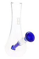 Clear Hemper 7-inch vase glass bong featuring cobalt blue angled downstem and bowl, minimalist tapered body on white backdrop.