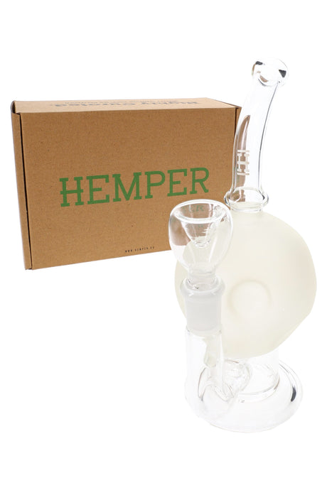 Hemper Full Moon frosted glass bong standing beside branded brown Hemper box, showing bent neck and compact pedestal base.