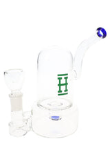 Hemper 7-inch bell bong with clear dome and blue-accent mouthpiece, compact glass water pipe with side-mounted bowl on white.
