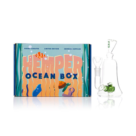 Hemper fish perc mini bong next to Ocean Box retail package, small-footprint glass bong for smooth filtered pulls