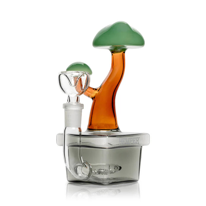 Side angle bonsai-themed glass bong highlighting square base footprint, stemless 14.5 mm female joint, and amber trunk