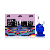 Hemper lollipop glass bong beside branded box, candy-style detailing with included bowl for compact smooth dry herb pulls