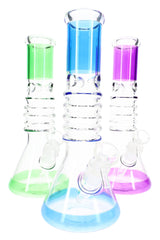 Clear 10″ beaker bong with colorful stacked ring accents and ice pinch in the neck, assorted colors