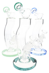 Assorted 9″ curved stemless matrix perc bongs with colored bases and mouthpieces, grouped on white background