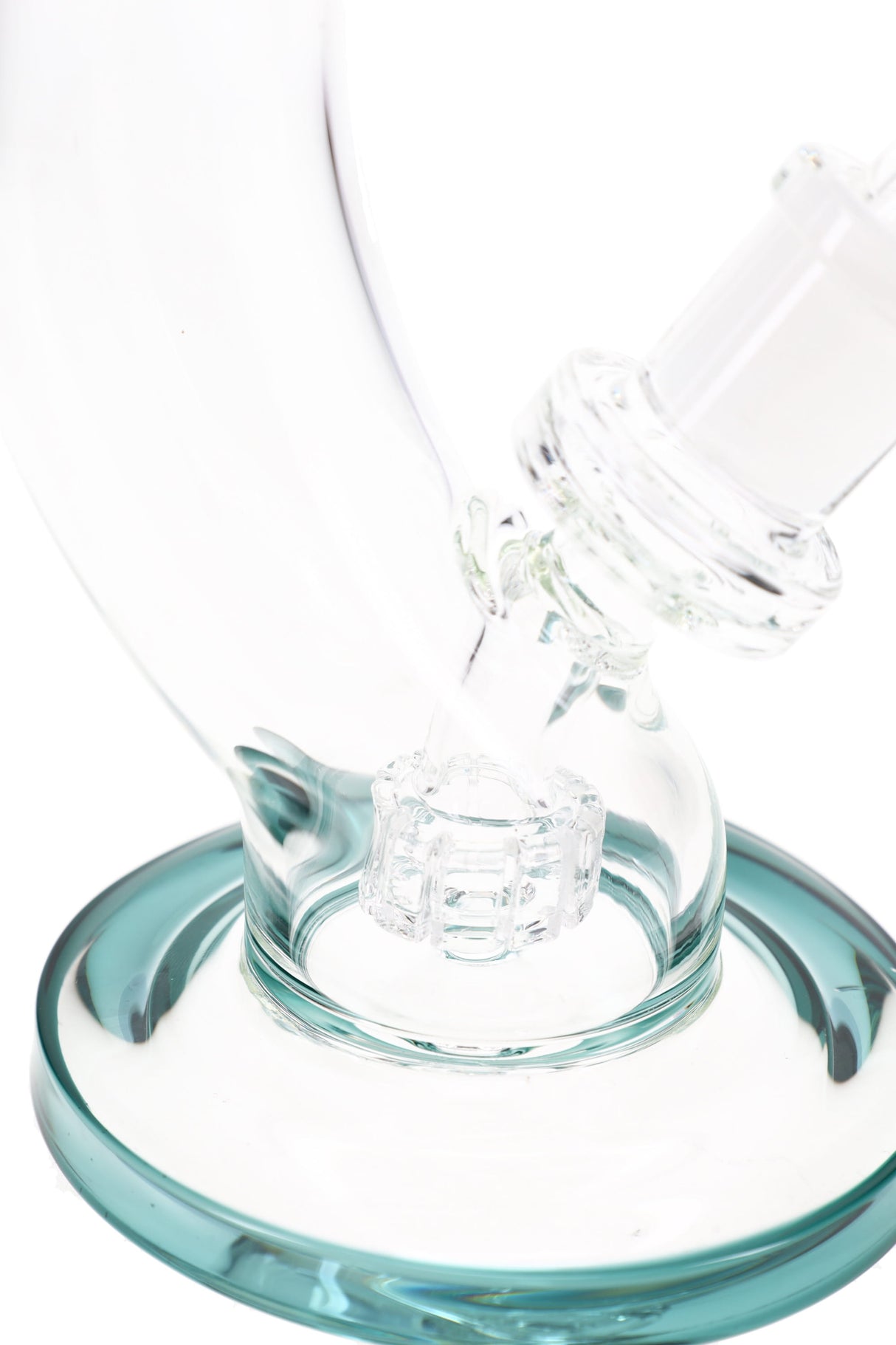 Close-up of matrix percolator chamber and teal base on curved stemless bong, diffusion detail shot
