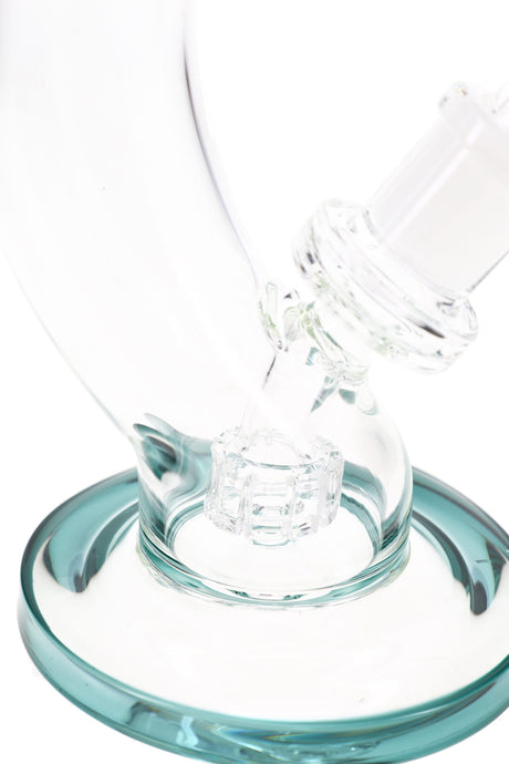 Close-up of matrix percolator chamber and teal base on curved stemless bong, diffusion detail shot
