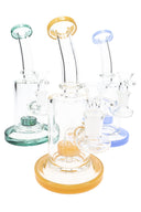 Assorted 7½″ stemless straight shooter bongs in blue, green, and amber accents with matching bowls