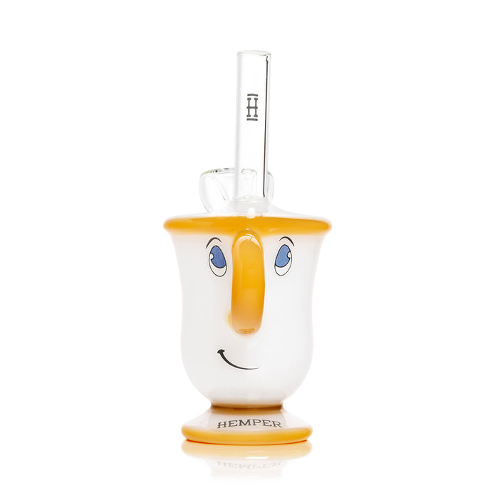 Front view tea cup glass bong showing smiling face, amber rim and base, clear straw mouthpiece with Hemper logo