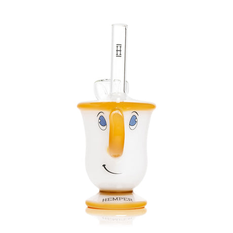 Front view tea cup glass bong showing smiling face, amber rim and base, clear straw mouthpiece with Hemper logo