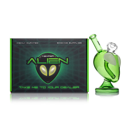 Hemper alien bong beside branded box, green alien head body with frosted eyes and recessed joint for daily use