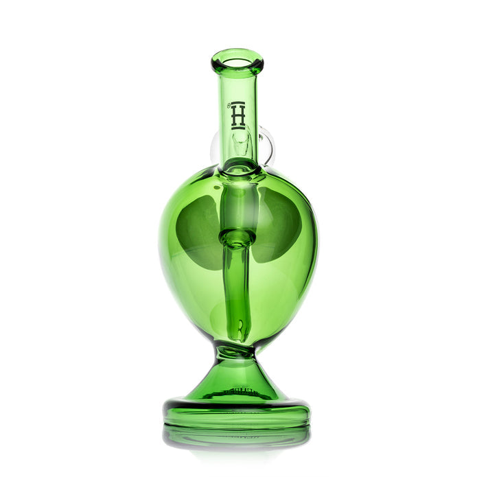 Rear view of alien head glass bong showing clear mouthpiece tube with Hemper logo and rounded green base shape