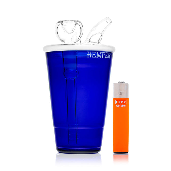 Blue beer pong cup glass bong beside orange lighter for size reference, clear splash mouthpiece and white rim visible