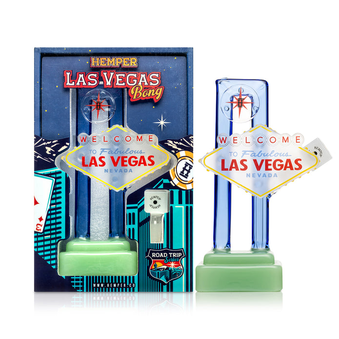 Angled view Las Vegas sign glass bong showing raised sign plaque, blue border, green base, and flower bowl included