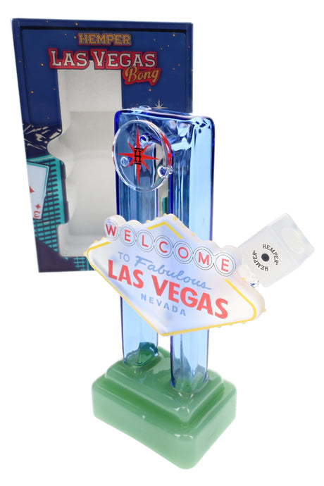 Hemper Las Vegas Sign XL bong with retail box behind, colorful marquee-style accents and compact 8″ profile display