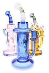 Assorted 10″ recycler bongs in blue, pink, and amber with curved necks and showerhead perc chambers