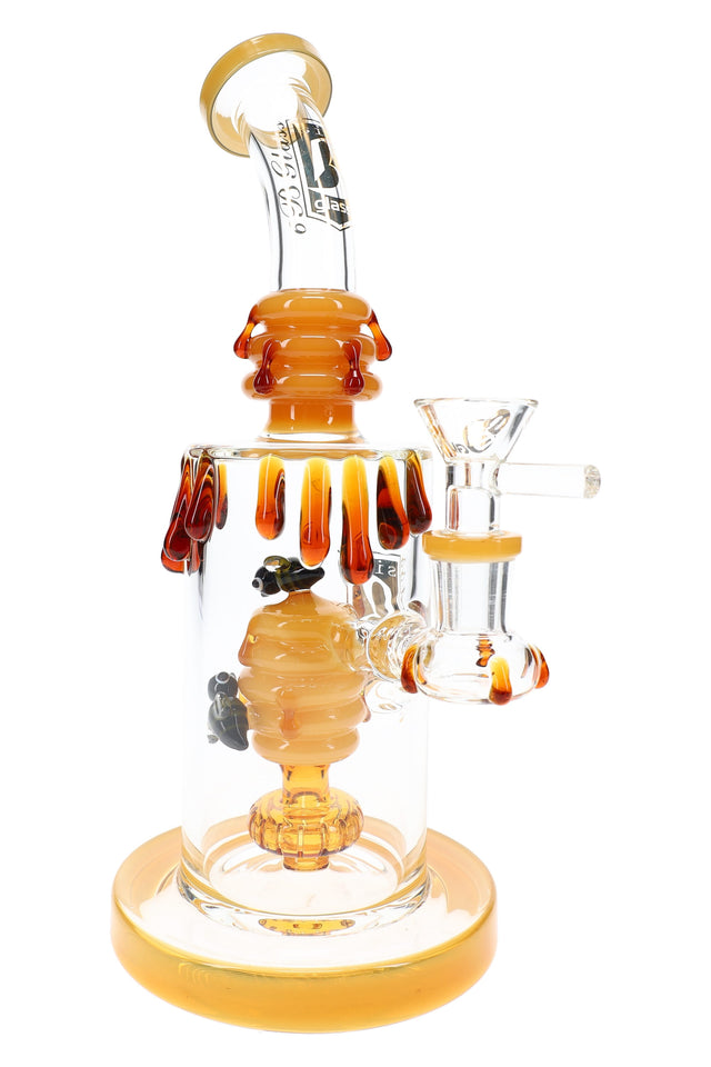 Amber 9.5″ glass bong with beehive centerpiece, showerhead perc, honey-drip accents, and clear 14.5 mm bowl