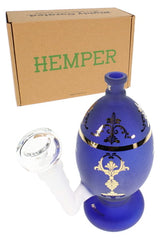 Frosted blue 6-inch glass bong with jeweled egg shape, clear bowl, and HEMPER retail box in angled view