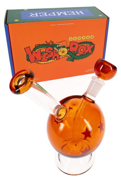 7-inch amber orb glass bong with red star graphics, angled stem, and HEMPER retail box in angled view