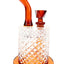 Amber Jane West water pipe angled view with disc mouthpiece, textured body, and warm glass accents