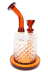 Amber Jane West water pipe angled view with disc mouthpiece, textured body, and warm glass accents