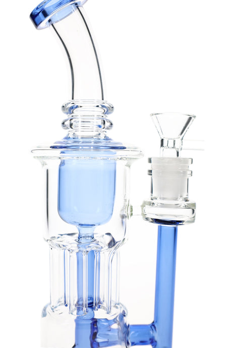 Blue-accented glass recycler bong close-up with stemless upright body, bowl joint, and looping chamber