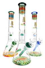 Reverse rasta glass beaker bong lineup with colored bases, clear bowls, ice pinches, and tall 16-inch bodies