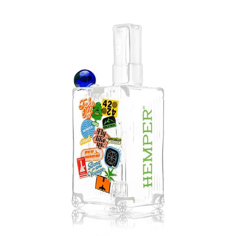 Angled view of the HEMPER Suitcase XL Bong with colorful graphics and green branding along the side