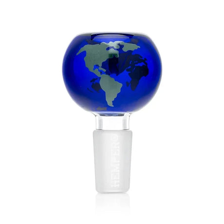 Close-up of the blue globe-shaped glass bowl with green continent graphics and a frosted male joint